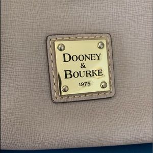 Dooney & Bourke Medium size satchel with adjustable removable crossbody strap.